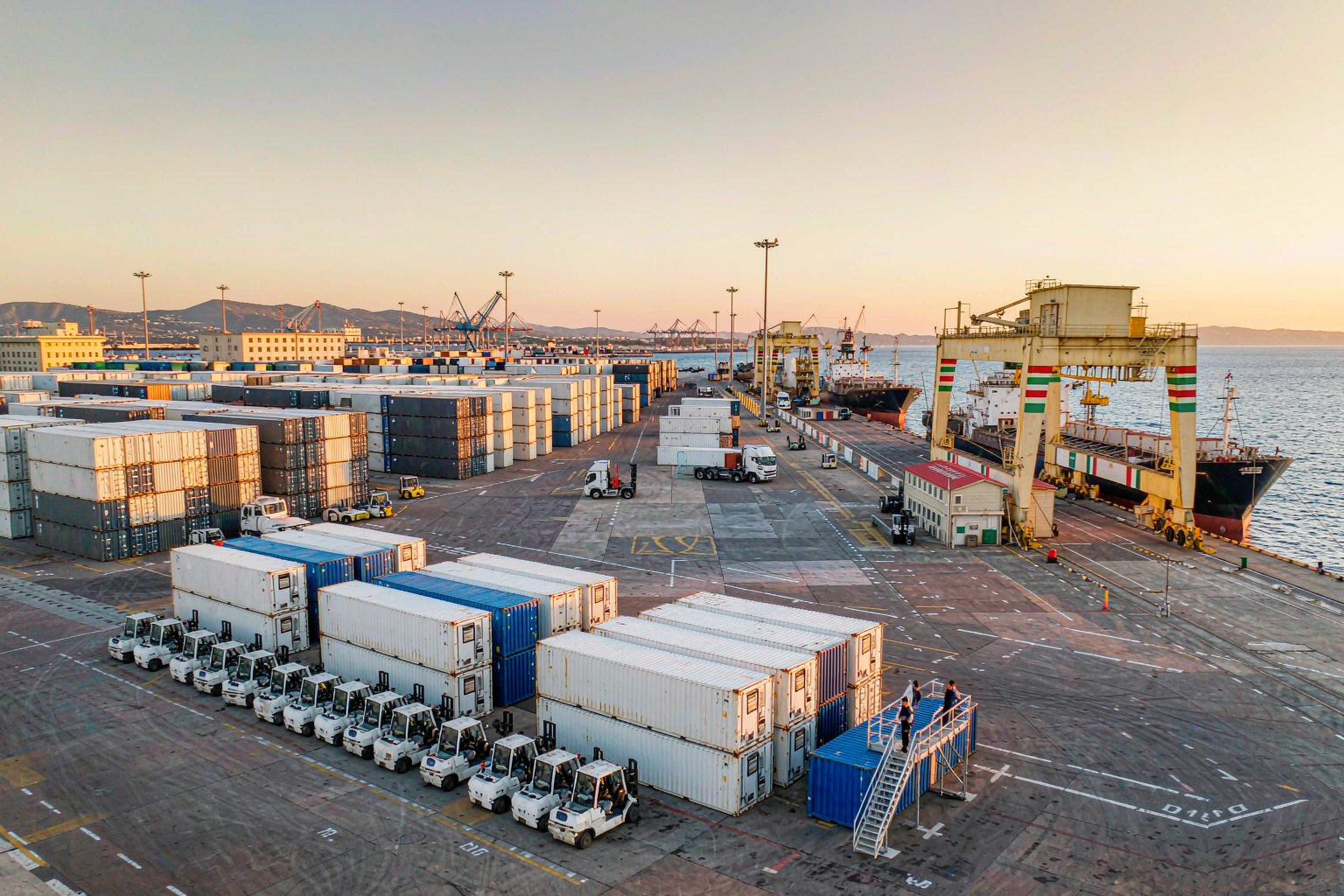 Latin American commercial seaport with reefer containers and cargo ship